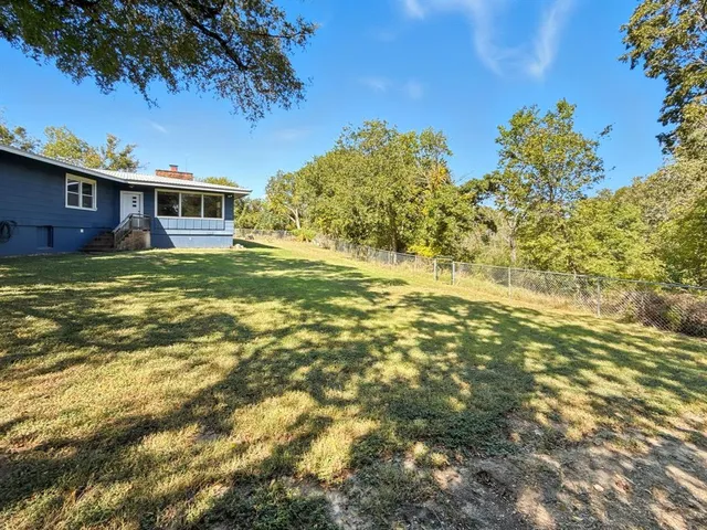 a view of outdoor space with trees all around