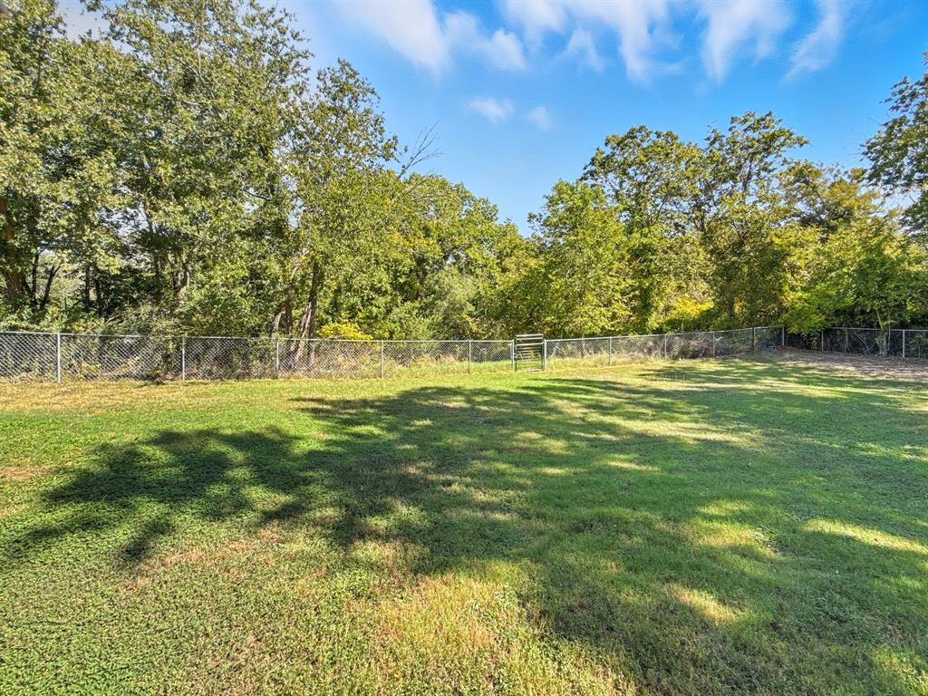 625 East Whitney Street Hamilton, TX 76531 - Photo 27 of 36 a view of outdoor space with trees all around