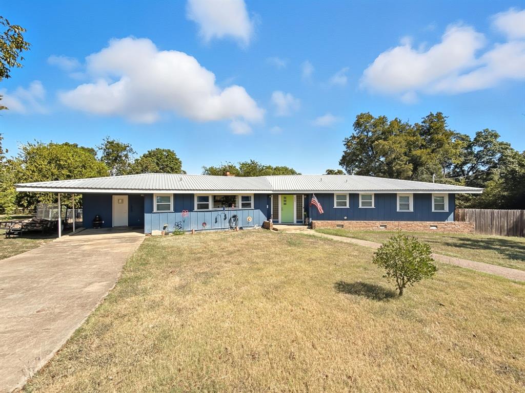 625 East Whitney Street Hamilton, TX 76531 - Photo 29 of 36 a view of a house next to a big yard