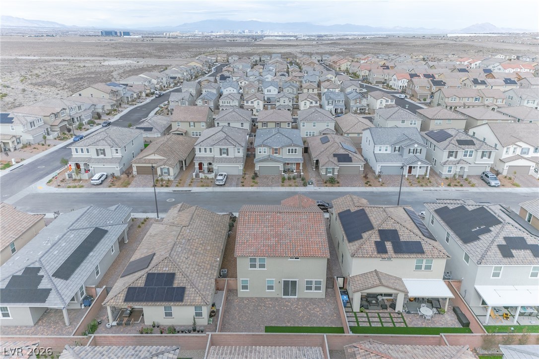 3765 Osiris Avenue Henderson, NV 89044 - Photo 17 of 40 Aerial perspective of suburban area with a mountainous background