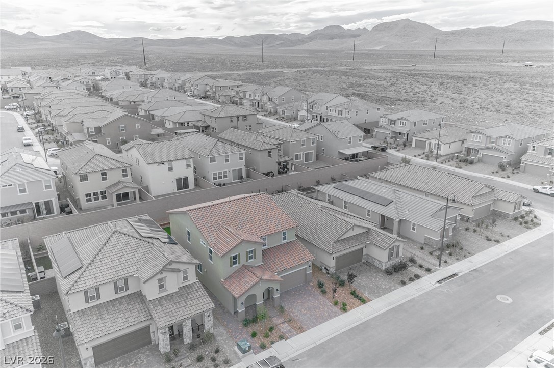 3765 Osiris Avenue Henderson, NV 89044 - Photo 20 of 40 Aerial perspective of suburban area featuring a mountain backdrop