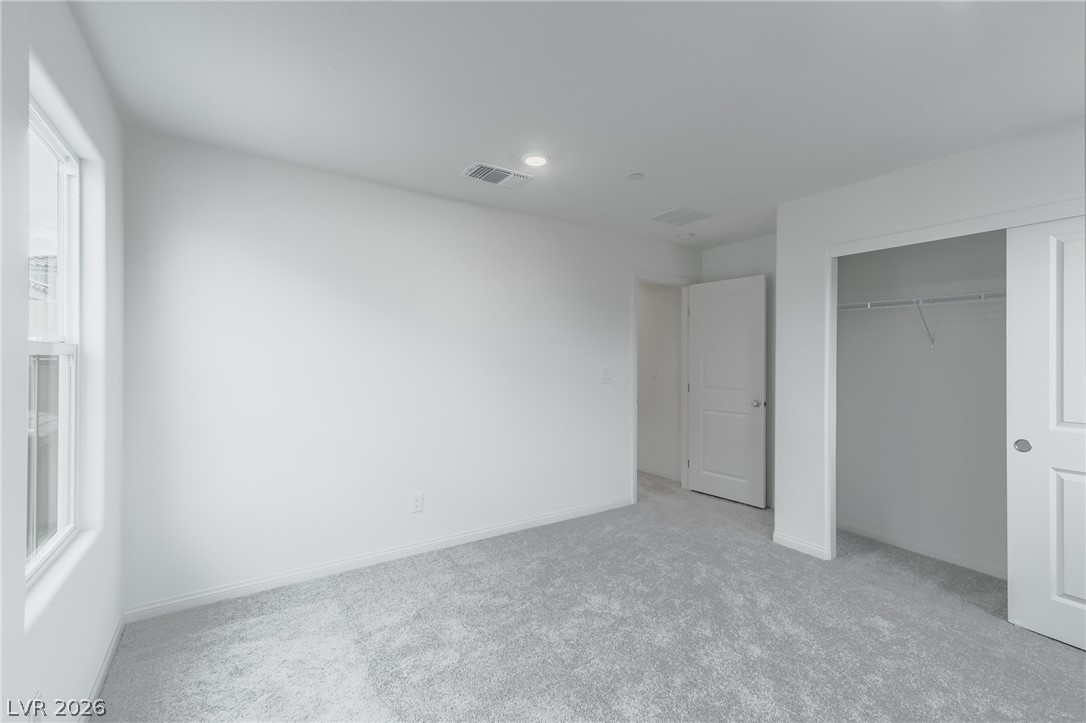 3765 Osiris Avenue Henderson, NV 89044 - Photo 23 of 40 Unfurnished bedroom featuring light carpet, a closet, and recessed lighting
