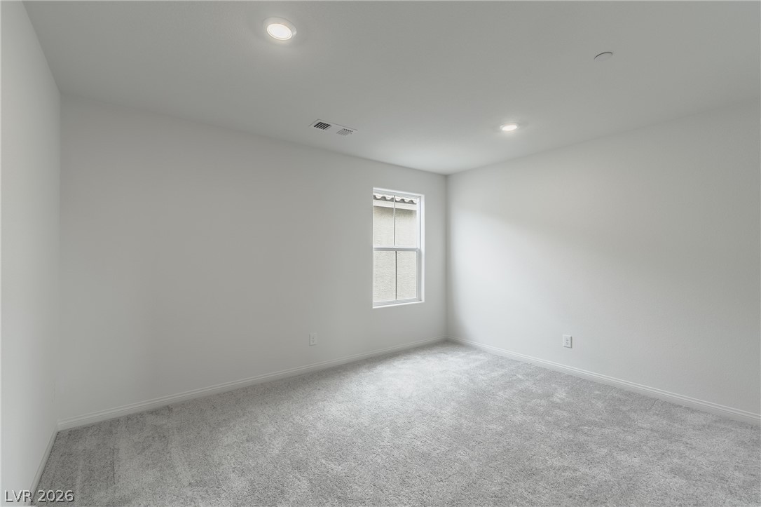 3765 Osiris Avenue Henderson, NV 89044 - Photo 25 of 40 Unfurnished room with light colored carpet and recessed lighting