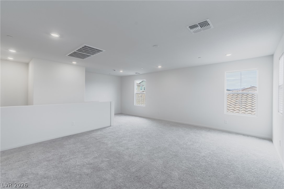 3765 Osiris Avenue Henderson, NV 89044 - Photo 27 of 40 Unfurnished room featuring light carpet and recessed lighting