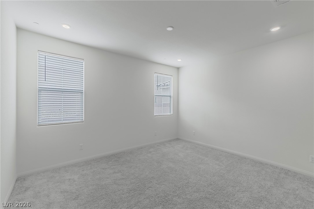 3765 Osiris Avenue Henderson, NV 89044 - Photo 30 of 40 Unfurnished room featuring light colored carpet and recessed lighting