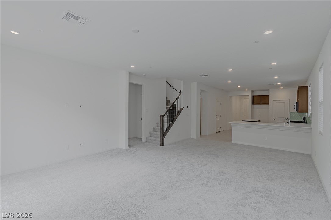 3765 Osiris Avenue Henderson, NV 89044 - Photo 34 of 40 Unfurnished living room featuring recessed lighting and light carpet
