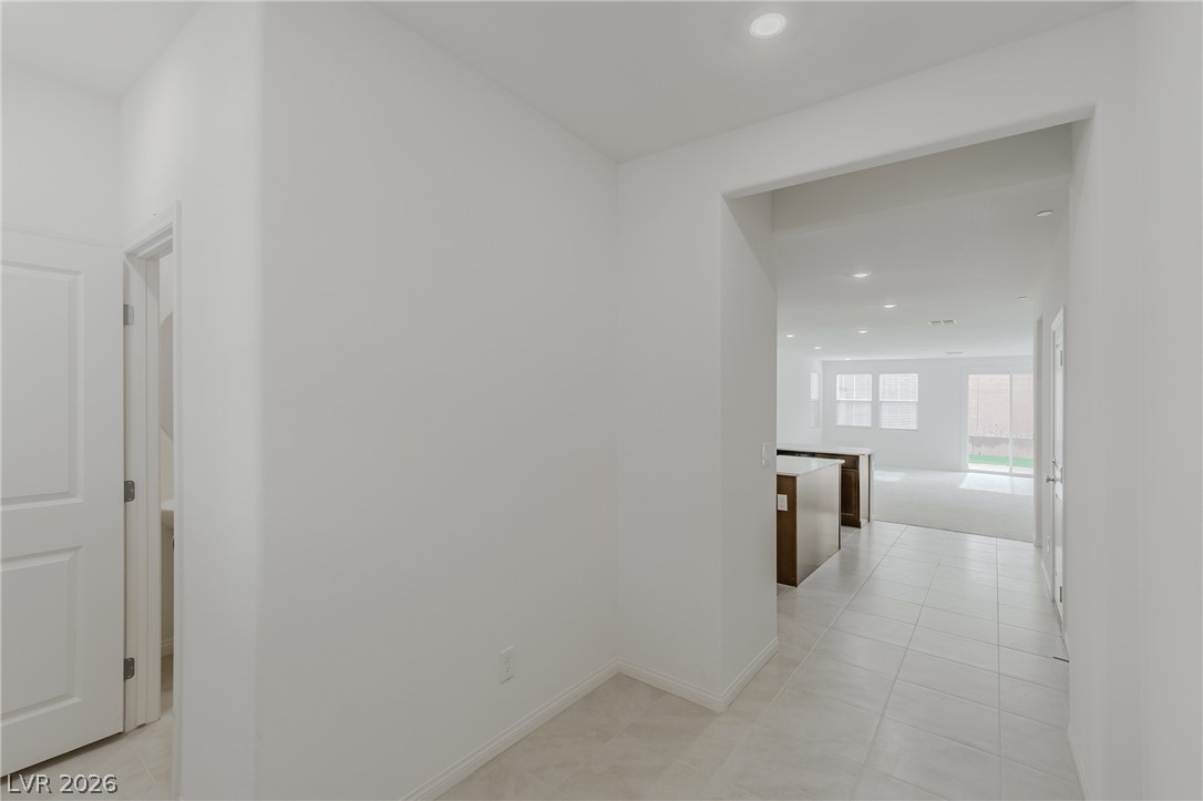 3765 Osiris Avenue Henderson, NV 89044 - Photo 38 of 40 Hallway with recessed lighting and light tile patterned floors