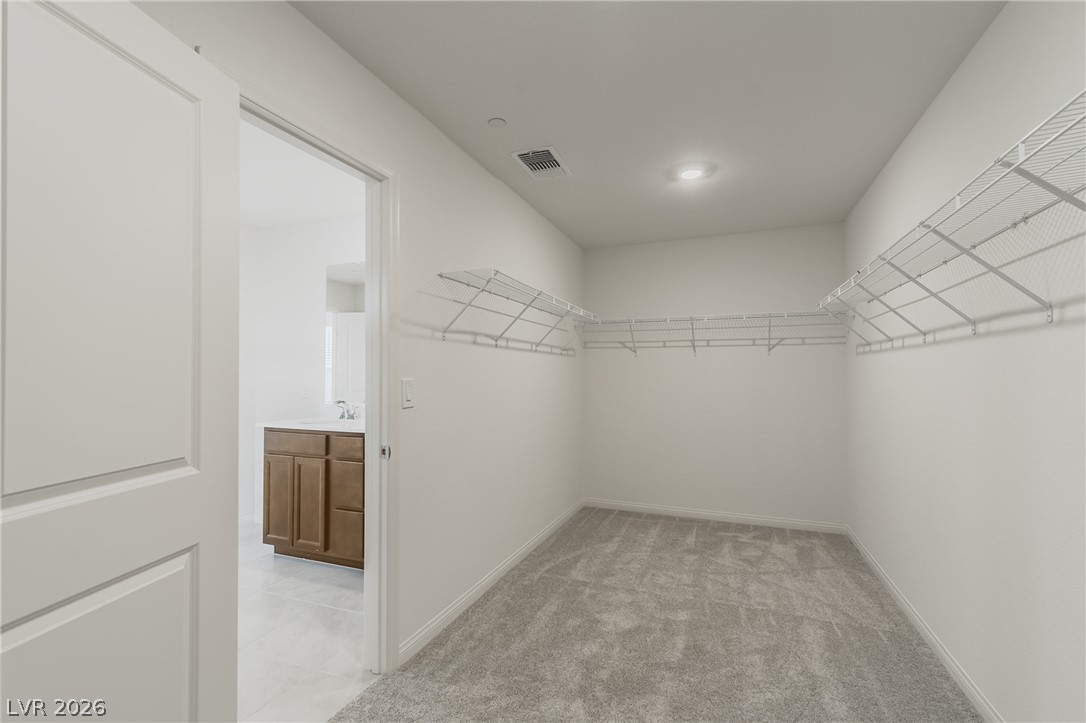 3765 Osiris Avenue Henderson, NV 89044 - Photo 8 of 40 Walk in closet with light colored carpet