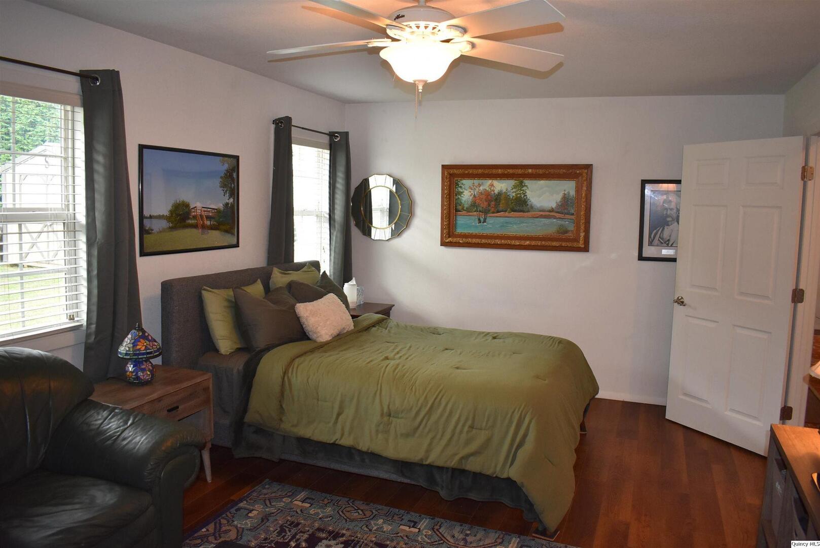 2319 Waters Court Quincy, IL 62301 - Photo 12 of 17 a bedroom with a bed and a painting on the wall