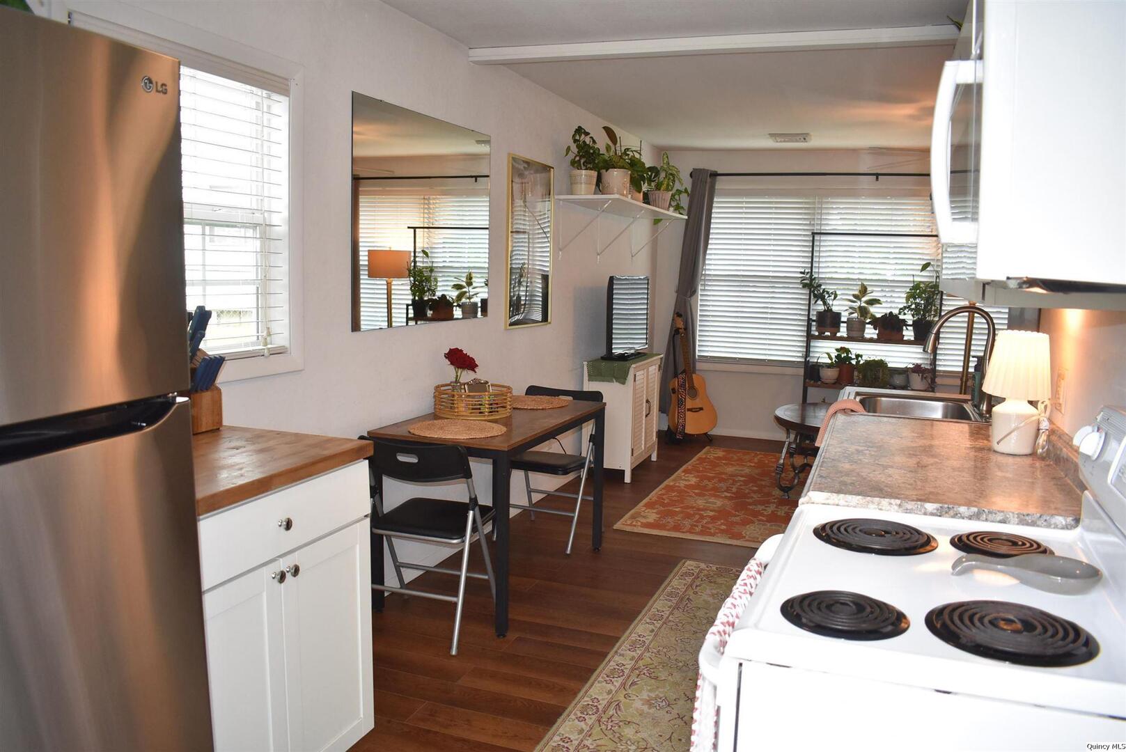 2319 Waters Court Quincy, IL 62301 - Photo 10 of 17 a very nice looking dining room with a large window