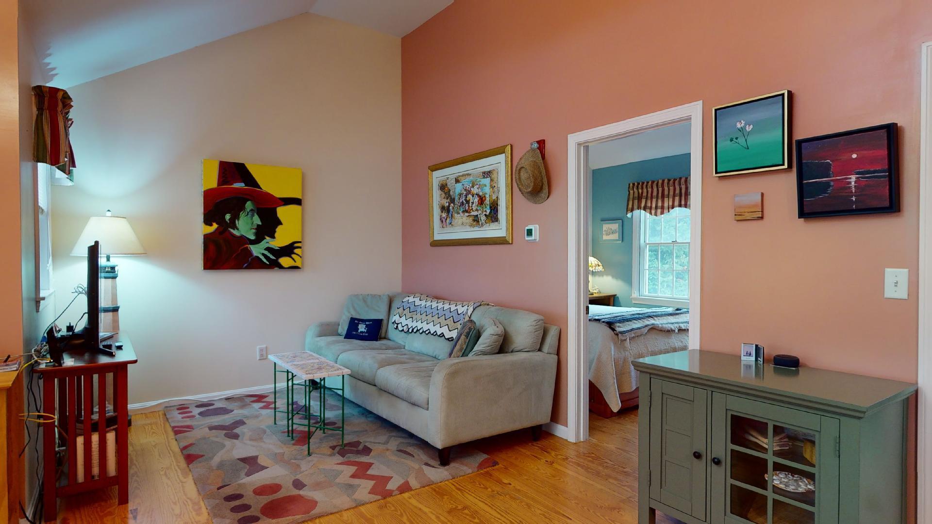 6 Shore Road, Unit 24 Truro, MA 02666 - Photo 12 of 46 a living room with furniture and wooden floor