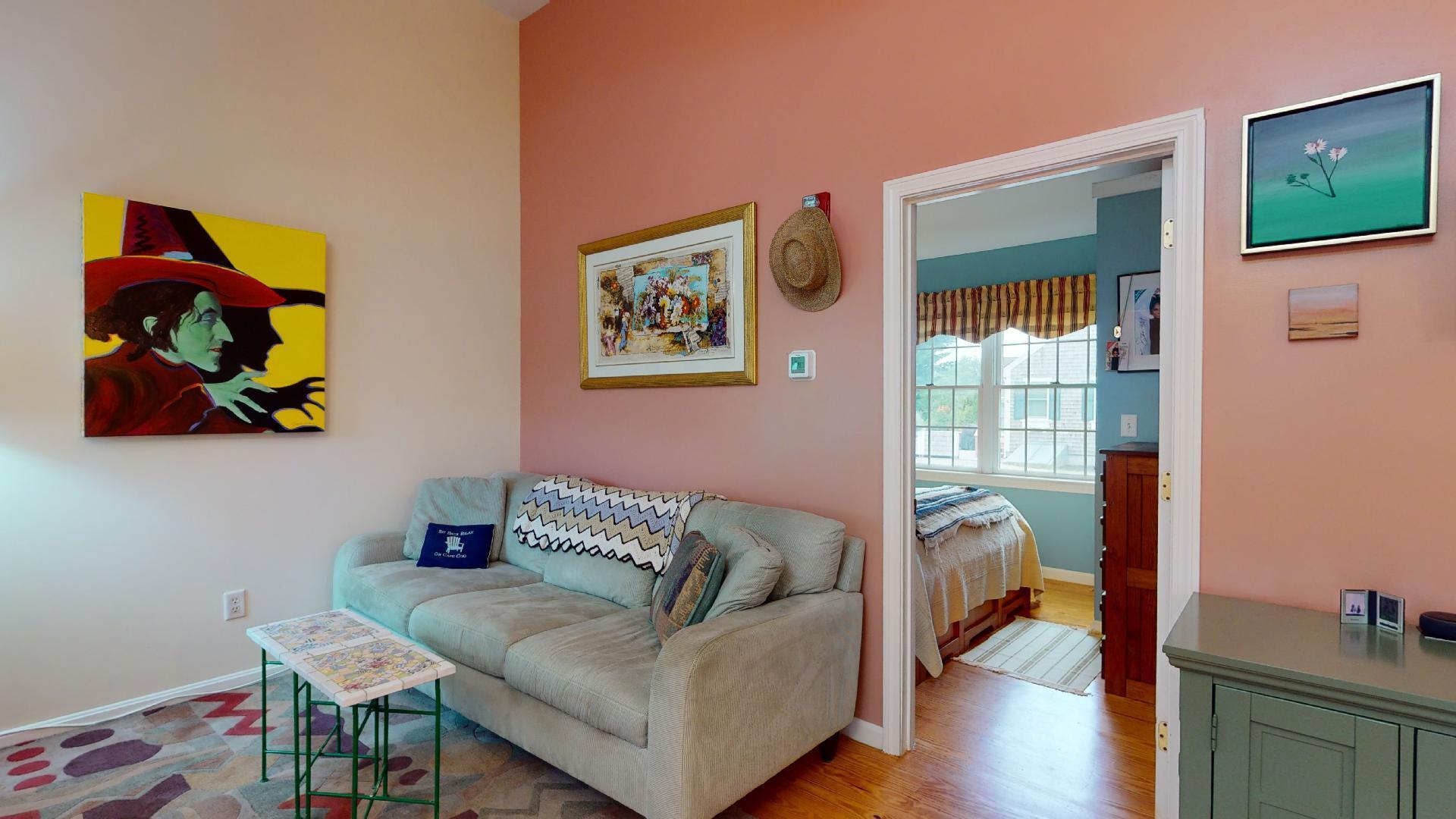 6 Shore Road, Unit 24 Truro, MA 02666 - Photo 13 of 46 a living room with furniture and a wooden floor