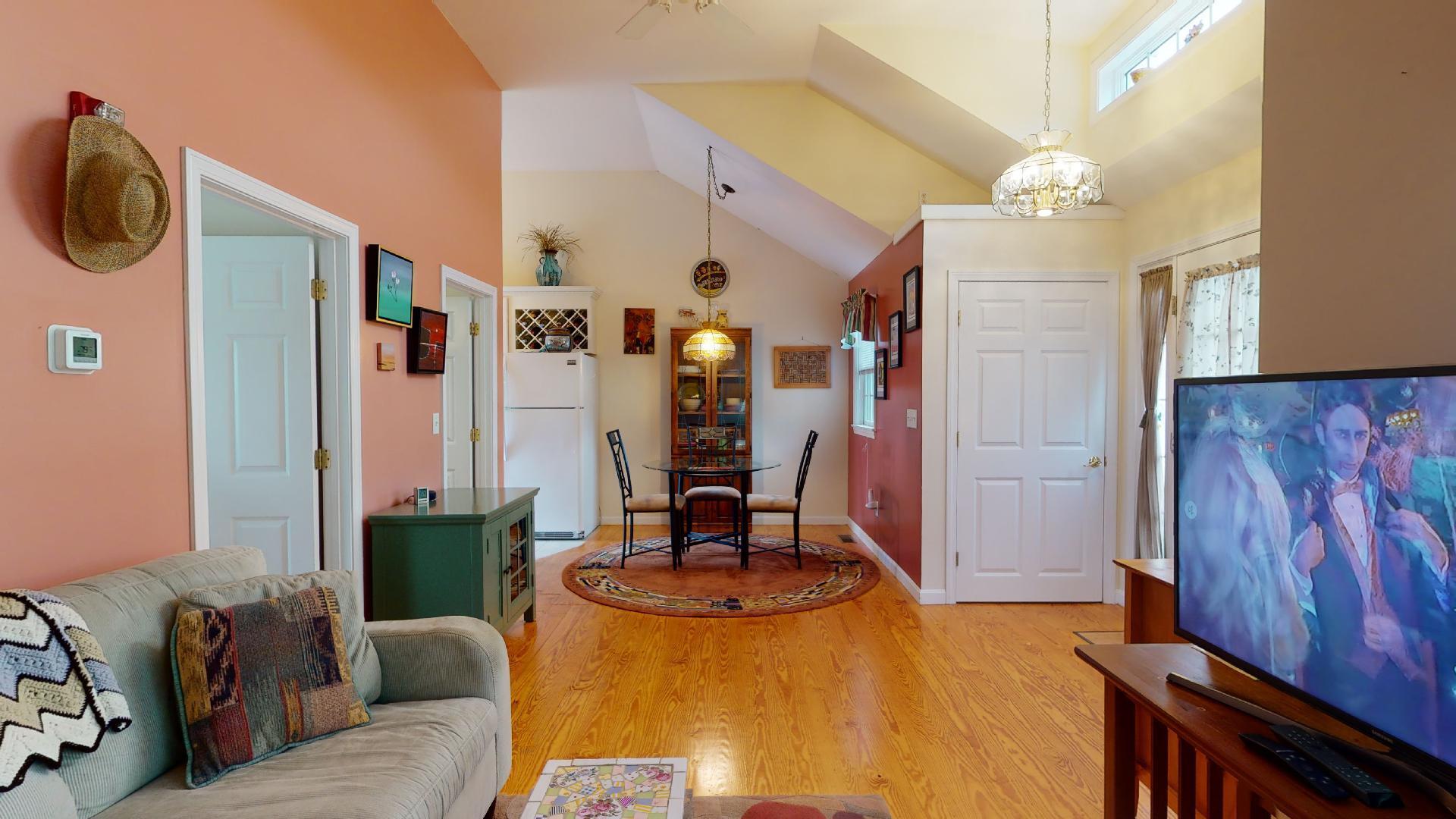 6 Shore Road, Unit 24 Truro, MA 02666 - Photo 15 of 46 a living room with furniture and a chandelier