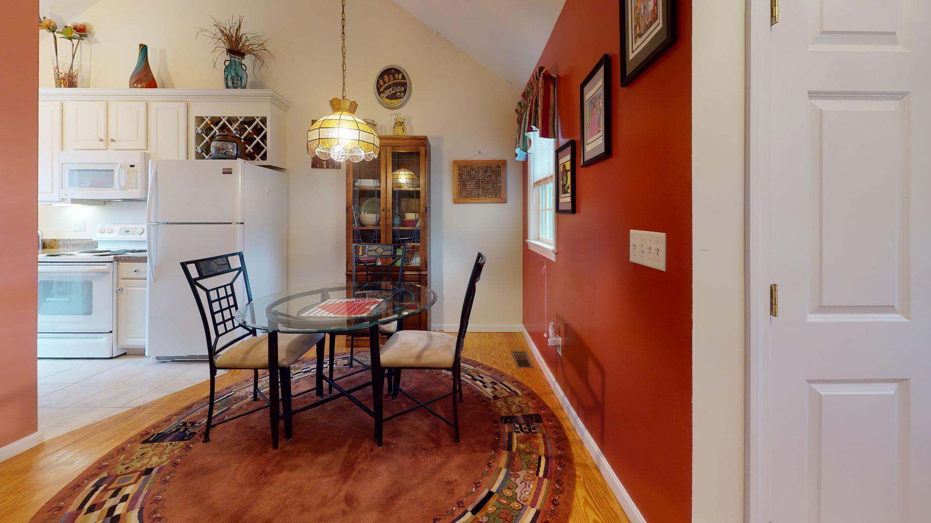 6 Shore Road, Unit 24 Truro, MA 02666 - Photo 16 of 46 a view of a dining room with furniture