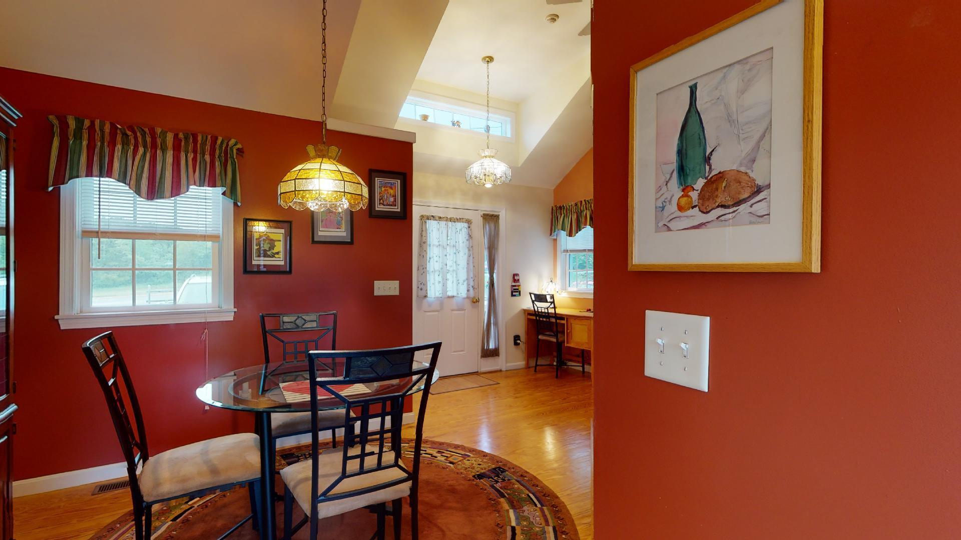 6 Shore Road, Unit 24 Truro, MA 02666 - Photo 18 of 46 a view of a dining room with furniture and a chandelier