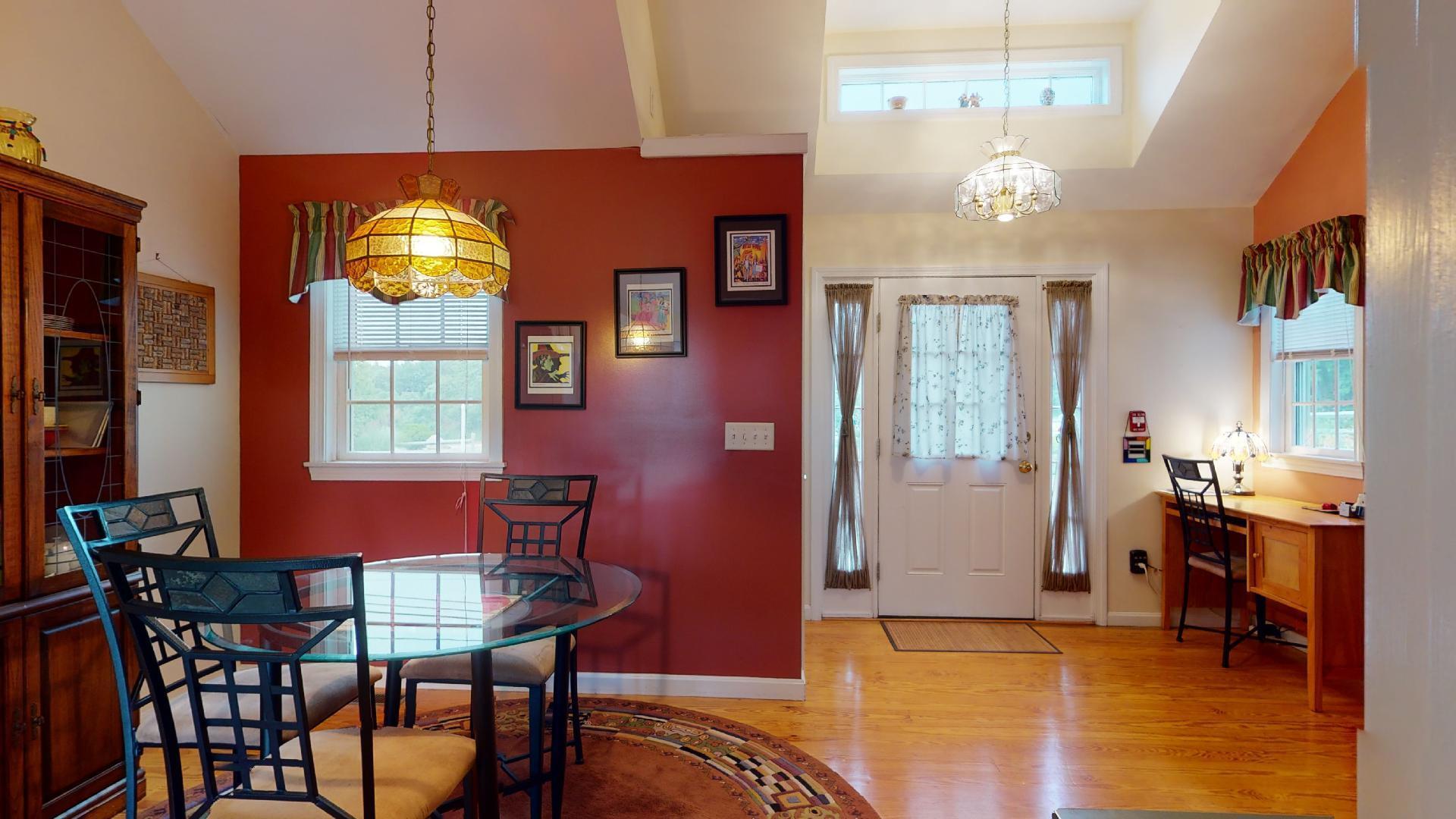 6 Shore Road, Unit 24 Truro, MA 02666 - Photo 19 of 46 a view of a dining room with furniture and chandelier