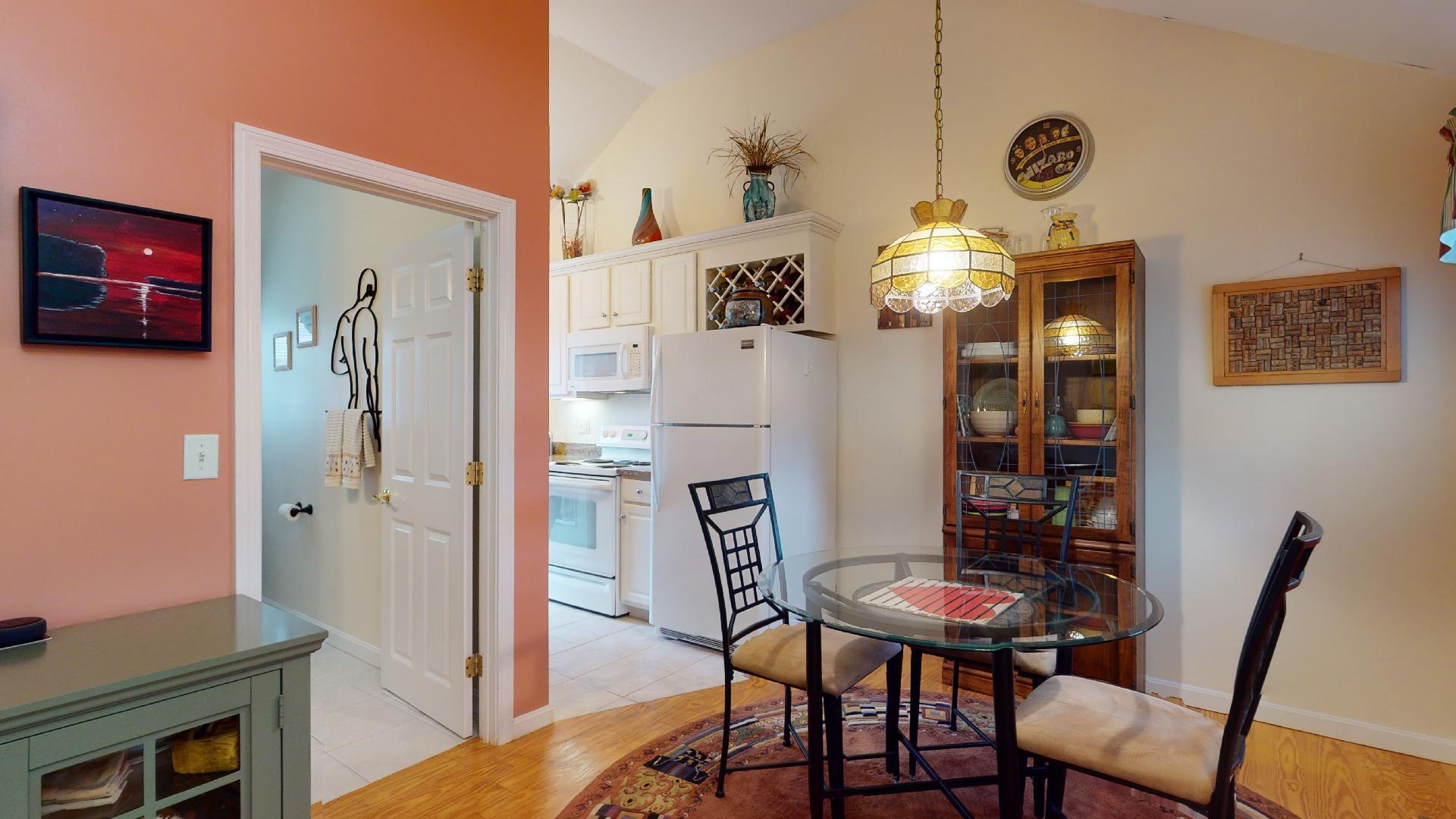 6 Shore Road, Unit 24 Truro, MA 02666 - Photo 20 of 46 a view of a dining room with furniture and wooden floor