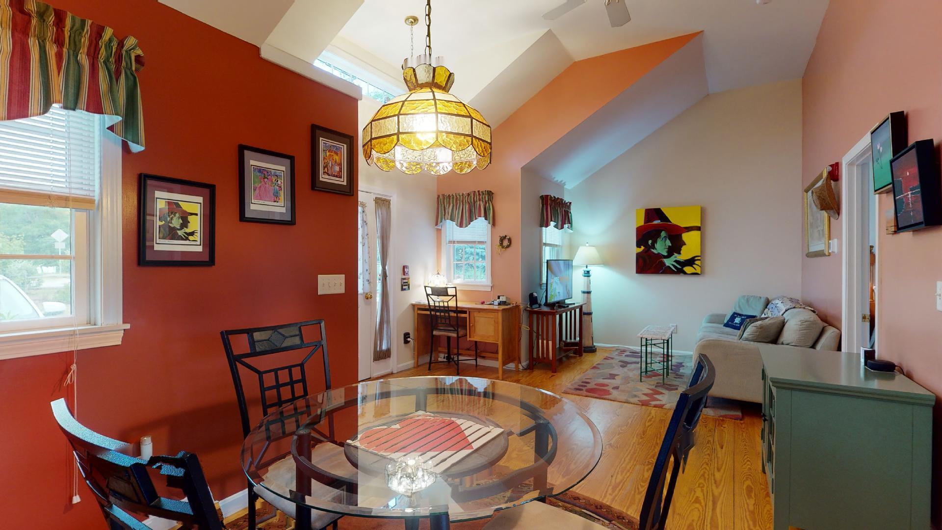 6 Shore Road, Unit 24 Truro, MA 02666 - Photo 2 of 46 a dining room with furniture a chandelier and window