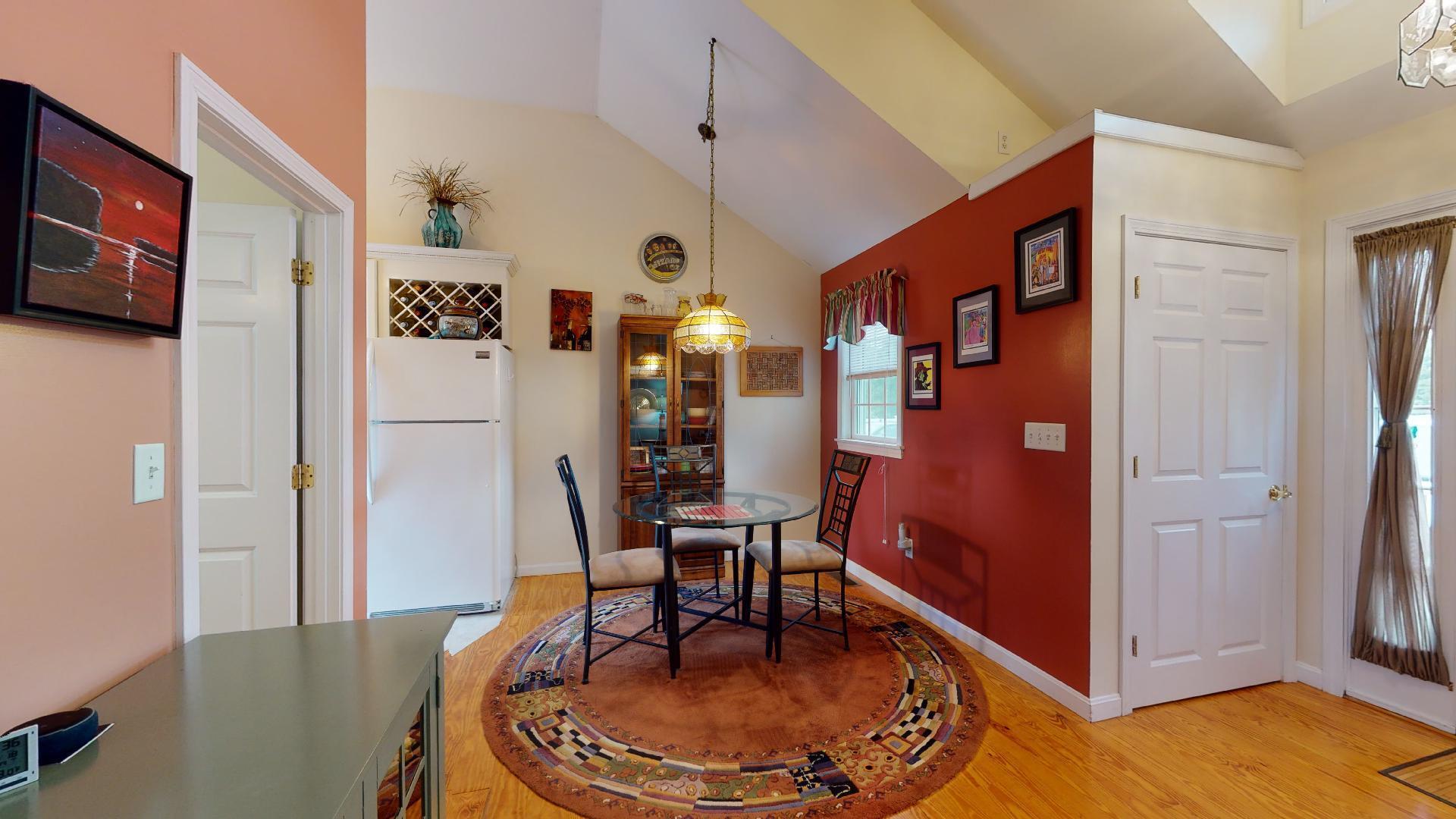 6 Shore Road, Unit 24 Truro, MA 02666 - Photo 21 of 46 a living room with furniture and a table
