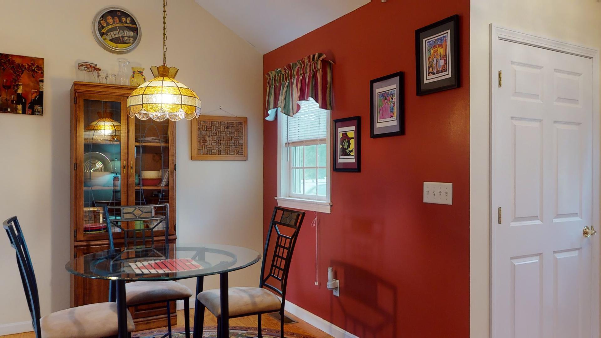6 Shore Road, Unit 24 Truro, MA 02666 - Photo 23 of 46 a view of a dining room with furniture and chandelier