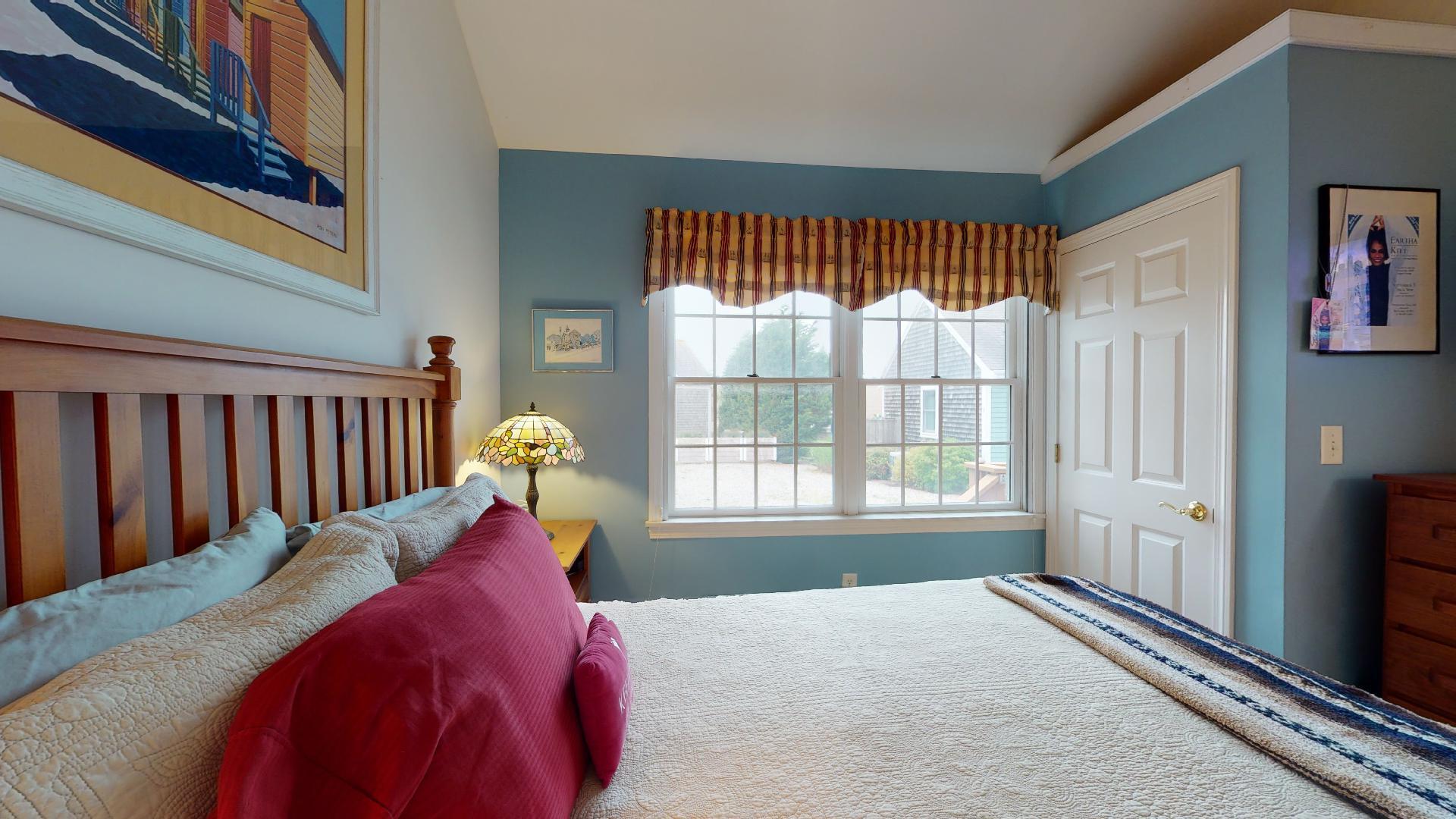 6 Shore Road, Unit 24 Truro, MA 02666 - Photo 30 of 46 a bed sitting in a bedroom next to a window
