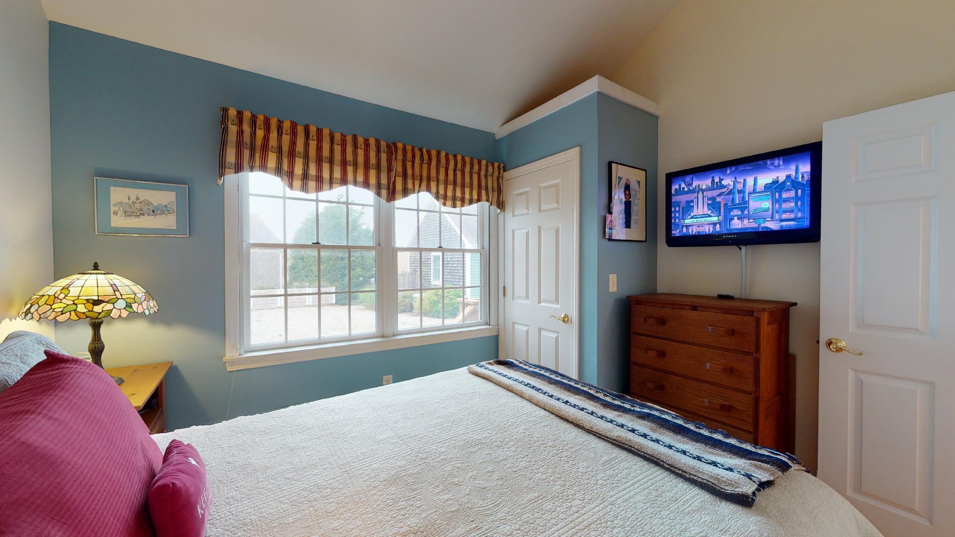 6 Shore Road, Unit 24 Truro, MA 02666 - Photo 31 of 46 a bedroom with a bed and a window