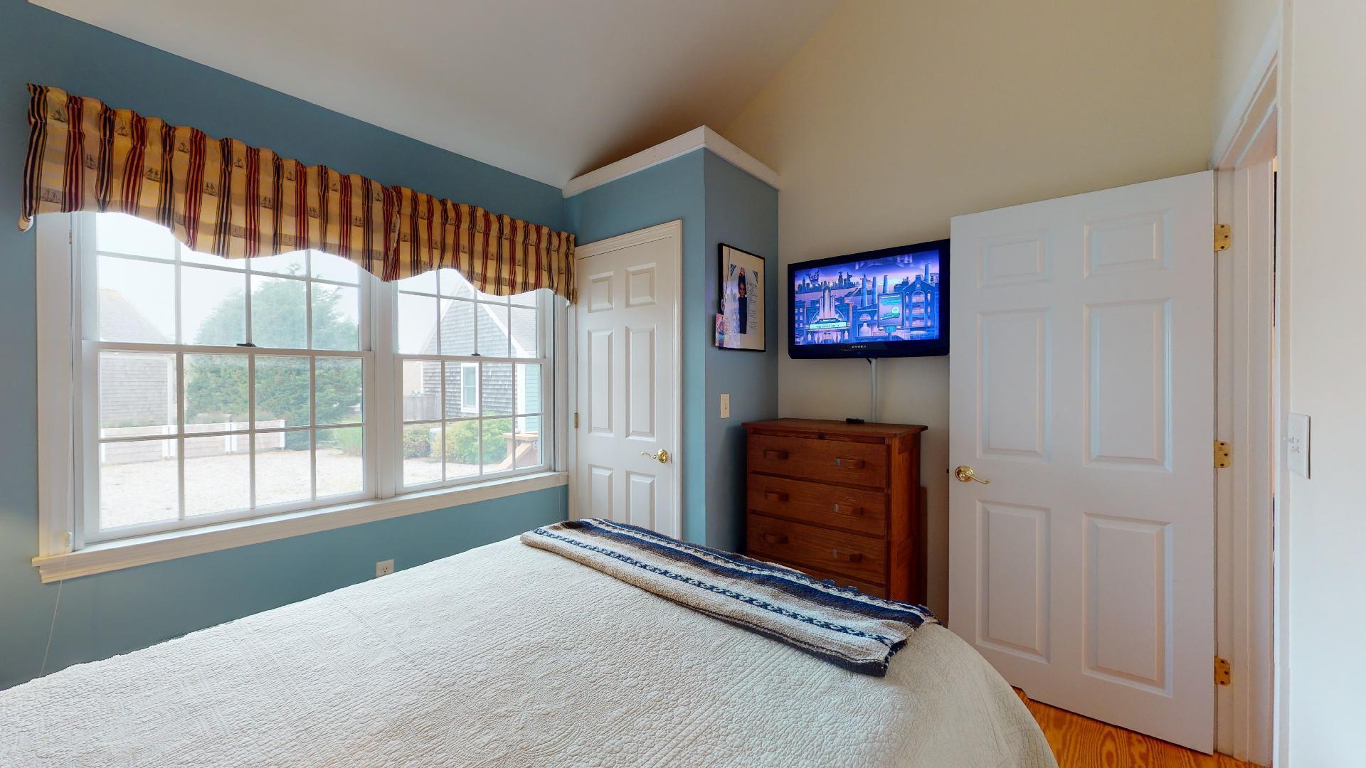 6 Shore Road, Unit 24 Truro, MA 02666 - Photo 32 of 46 a living room with furniture and a flat screen tv