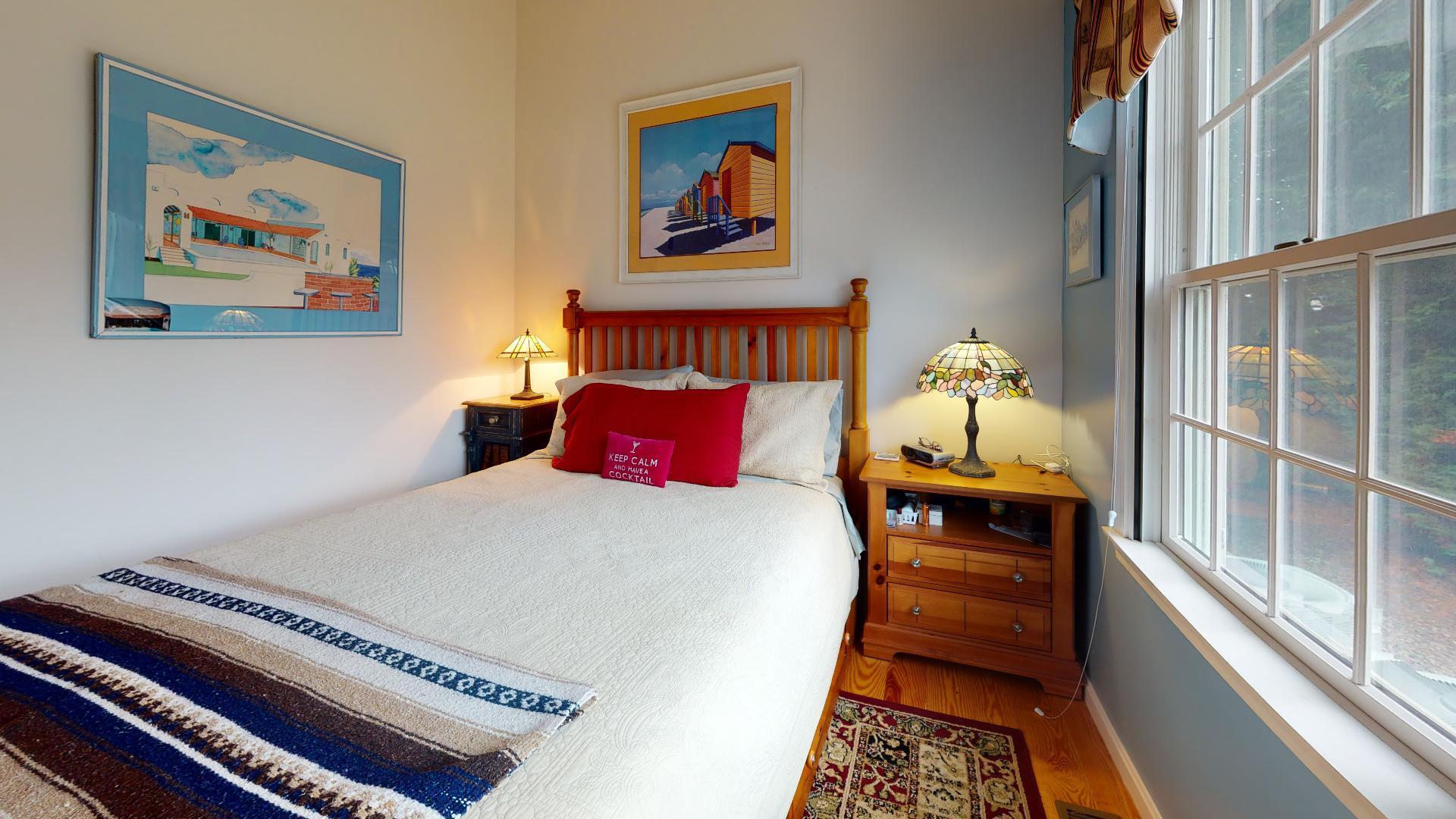 6 Shore Road, Unit 24 Truro, MA 02666 - Photo 34 of 46 a bed sitting in a bedroom next to a window