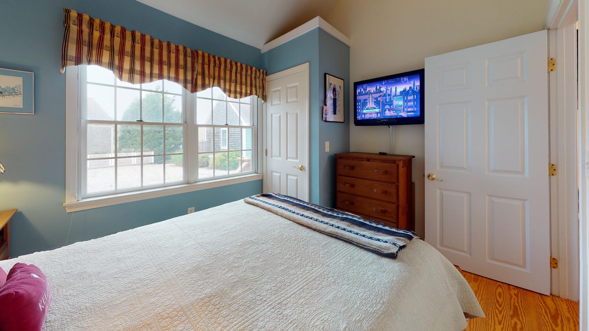 6 Shore Road, Unit 24 Truro, MA 02666 - Photo 35 of 46 a bedroom with a bed and a window