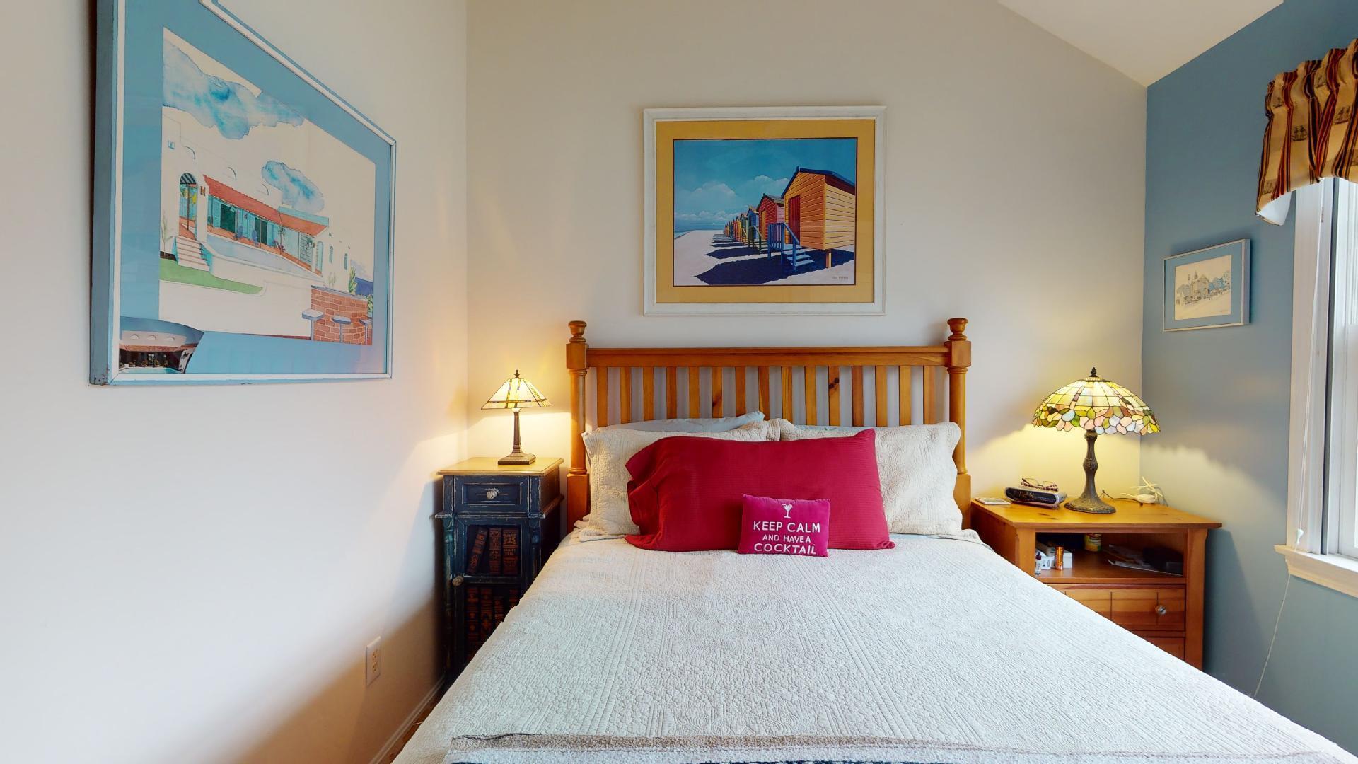 6 Shore Road, Unit 24 Truro, MA 02666 - Photo 38 of 46 a bedroom with bed and wall painting