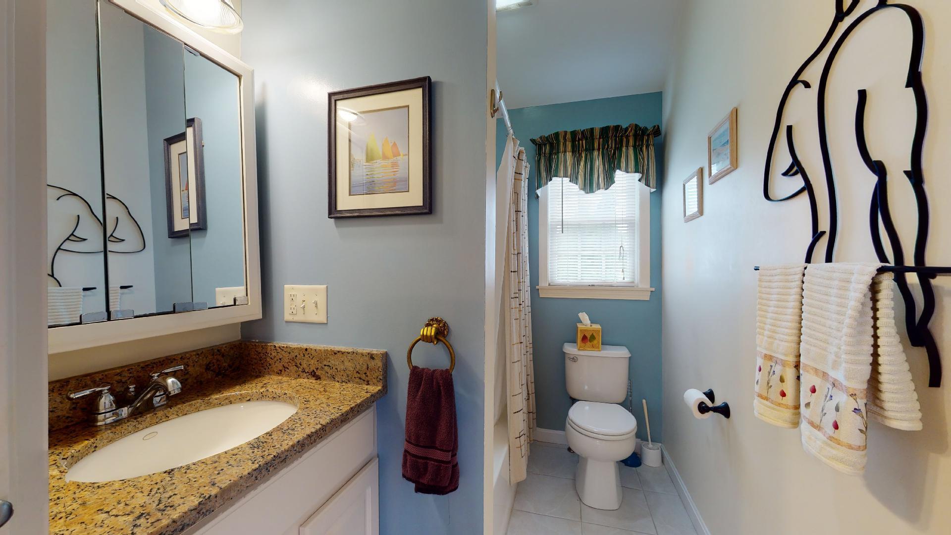 6 Shore Road, Unit 24 Truro, MA 02666 - Photo 40 of 46 a bathroom with a granite countertop sink toilet and shower
