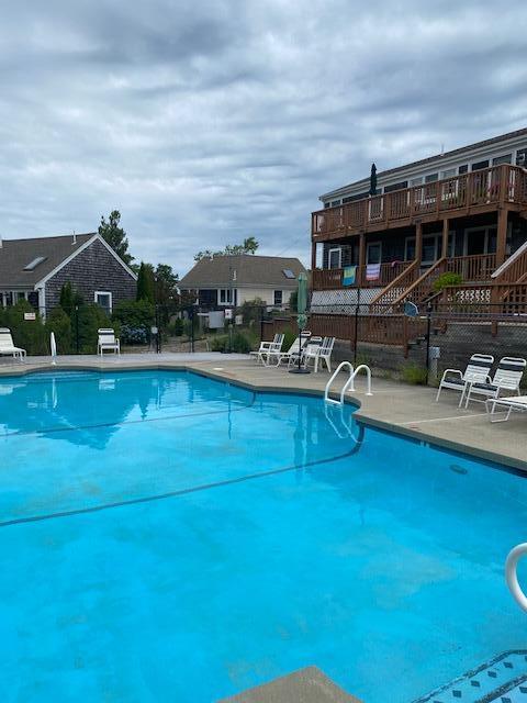 6 Shore Road, Unit 24 Truro, MA 02666 - Photo 44 of 46 a view of a house with pool and chairs