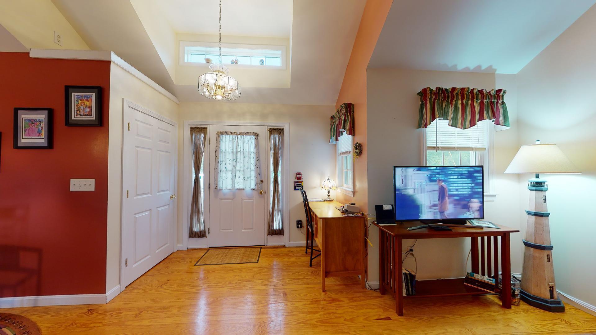 6 Shore Road, Unit 24 Truro, MA 02666 - Photo 8 of 46 a view of a livingroom with furniture window and wooden floor