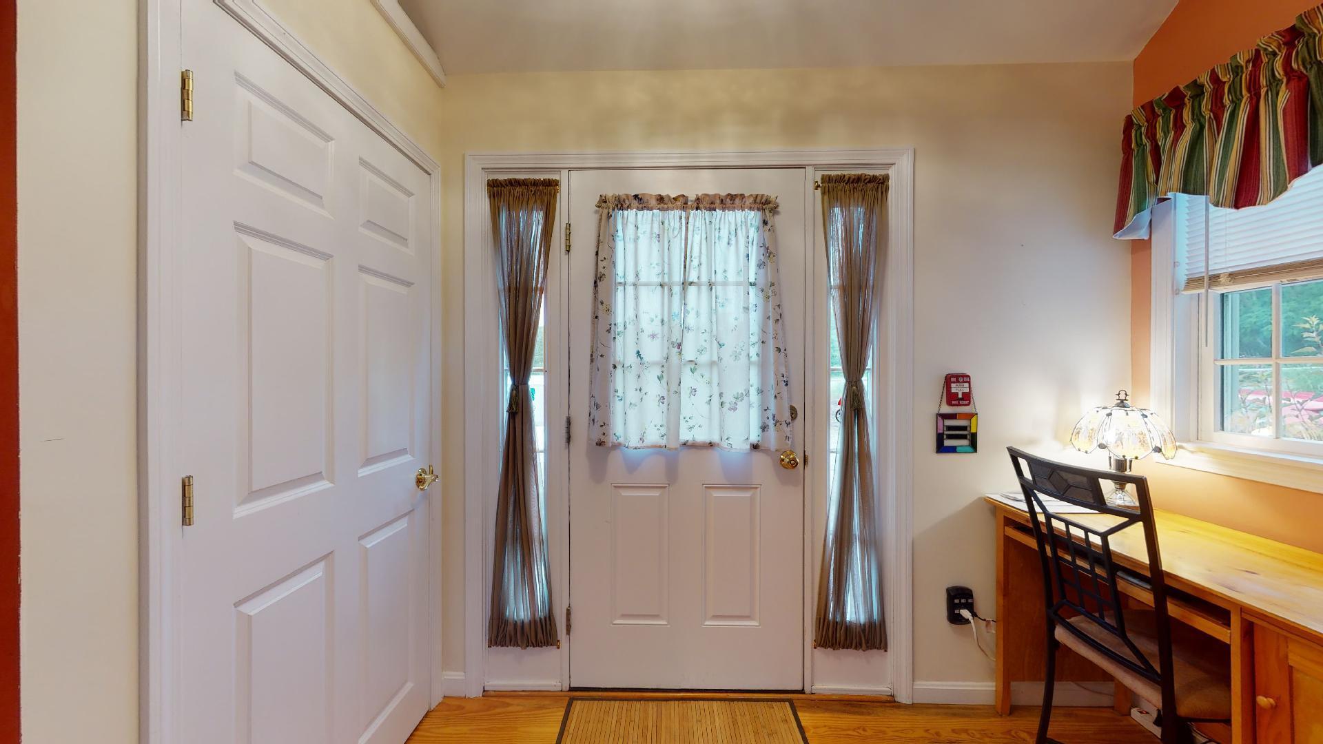 6 Shore Road, Unit 24 Truro, MA 02666 - Photo 9 of 46 a view of a livingroom with wooden floor and furniture