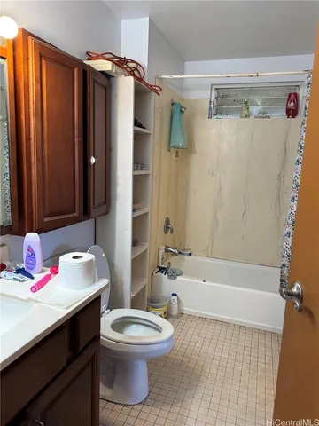 a kitchen with a refrigerator and a stove top oven