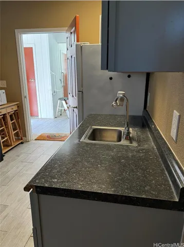 a white refrigerator freezer sitting in a kitchen