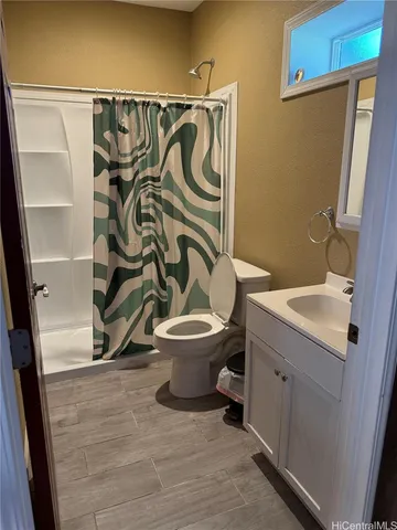 a bedroom with a bed and a desk