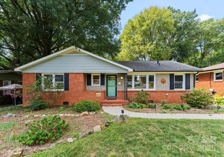 a front view of a house with a yard and porch