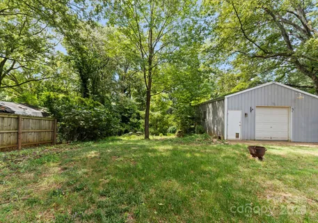 a house with green field in front of it