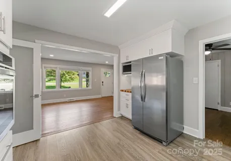 a kitchen with stainless steel appliances a refrigerator and a sink