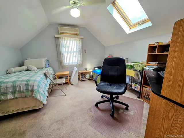 a bedroom with furniture and a window