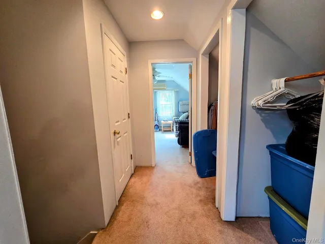 a view of a hallway and closet