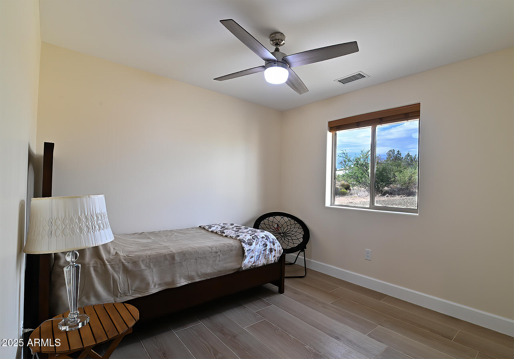 20214 East Mesa Verde Road Mayer, AZ 86333 - Photo 12 of 26 a bedroom with a bed and a window