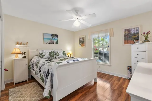 a bed room with a bed and a window