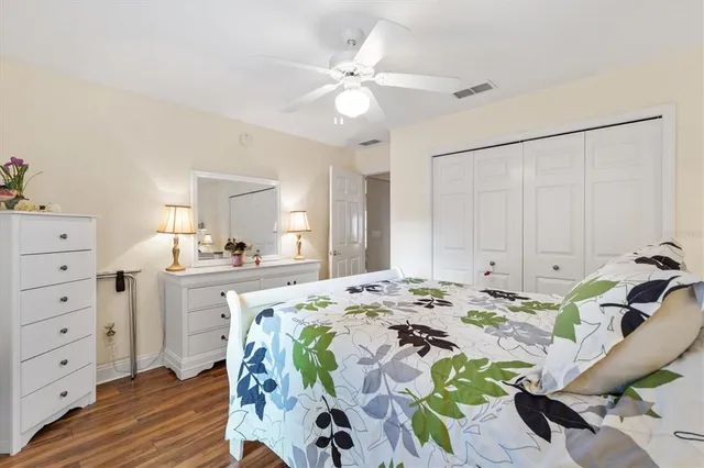 a bed room with a bed and a chandelier