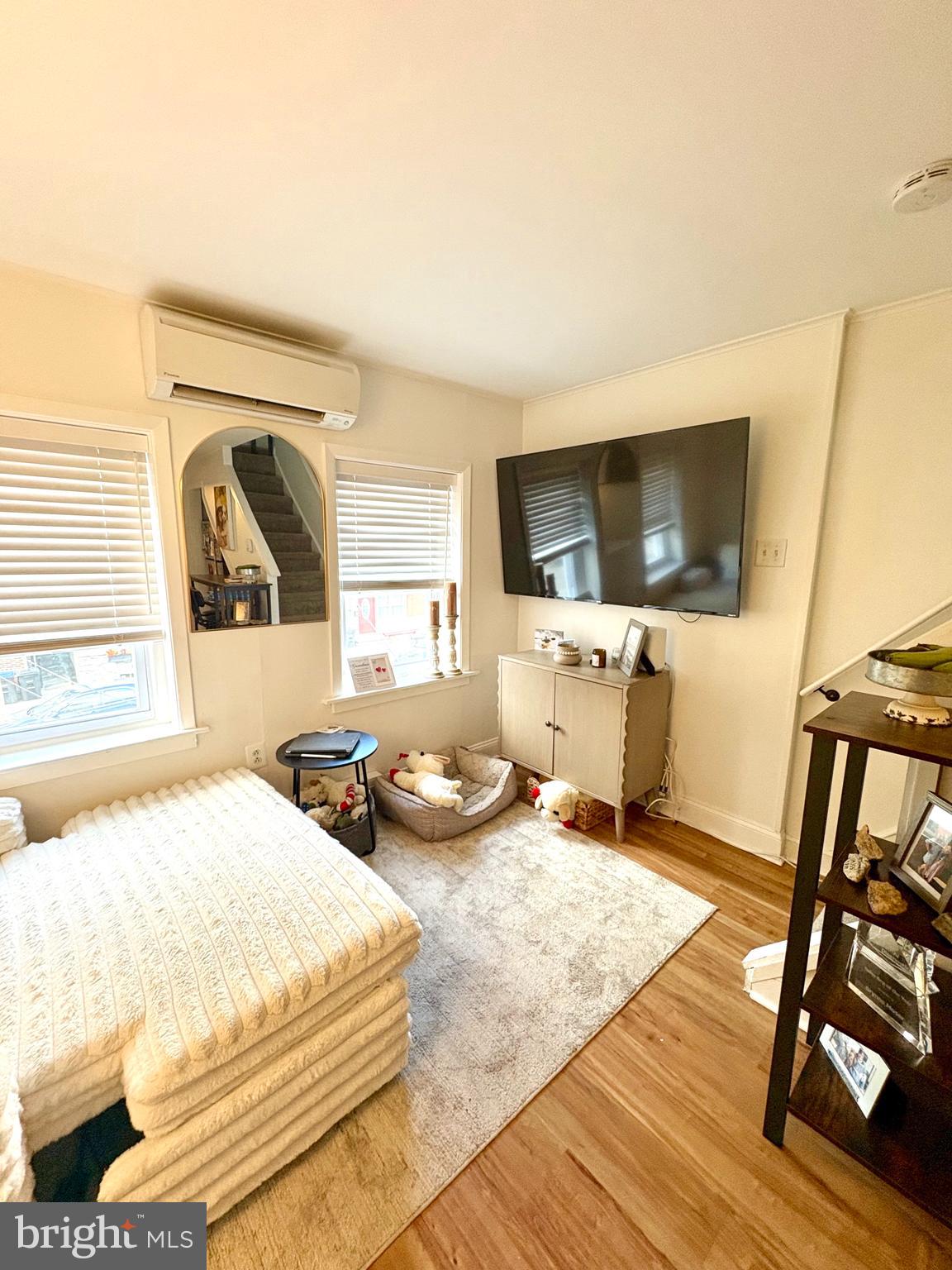 119 1/2 Maple Street, Unit 2 Conshohocken, PA 19428 - Photo 14 of 28 a bedroom with a bed and a flat screen tv