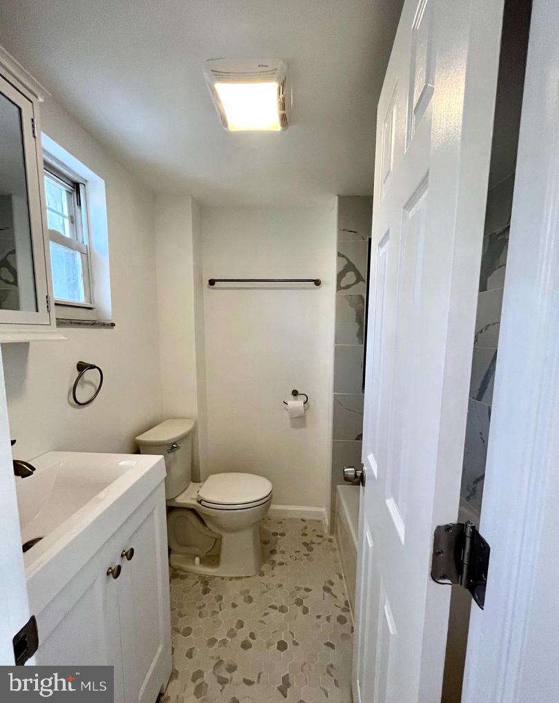 119 1/2 Maple Street, Unit 2 Conshohocken, PA 19428 - Photo 16 of 28 a bathroom with a sink toilet vanity and shower