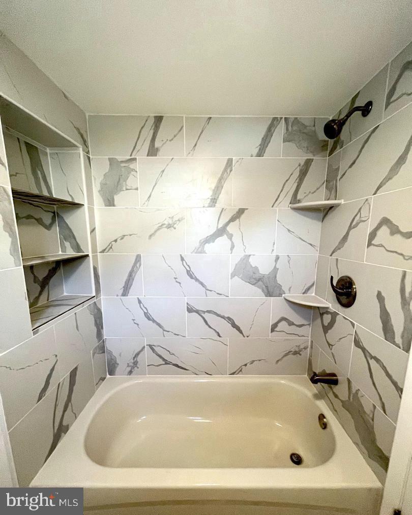 119 1/2 Maple Street, Unit 2 Conshohocken, PA 19428 - Photo 18 of 28 a bathroom with a bathtub