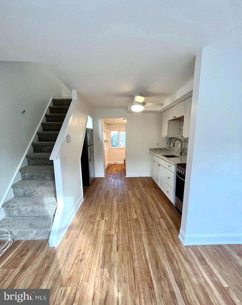 119 1/2 Maple Street, Unit 2 Conshohocken, PA 19428 - Photo 2 of 28 a view of a kitchen with wooden floor and electronic appliances