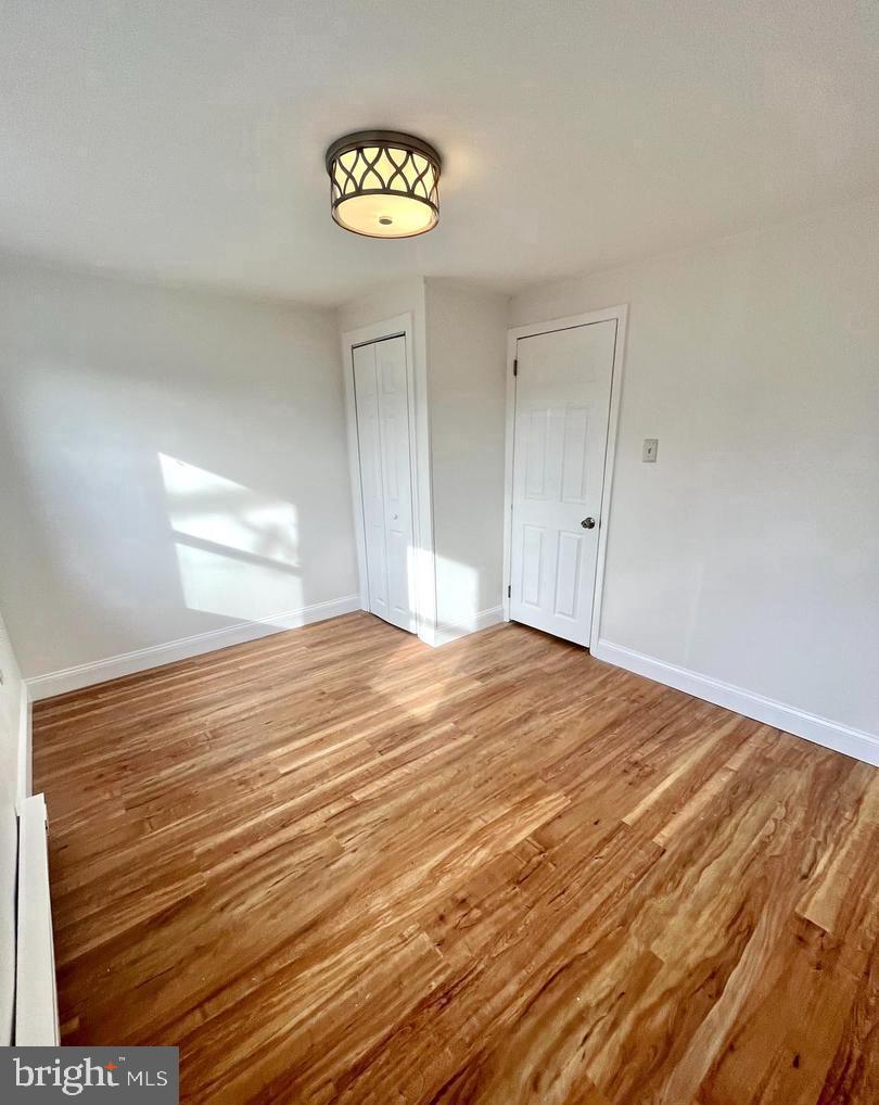 119 1/2 Maple Street, Unit 2 Conshohocken, PA 19428 - Photo 21 of 28 a view of empty room with wooden floor